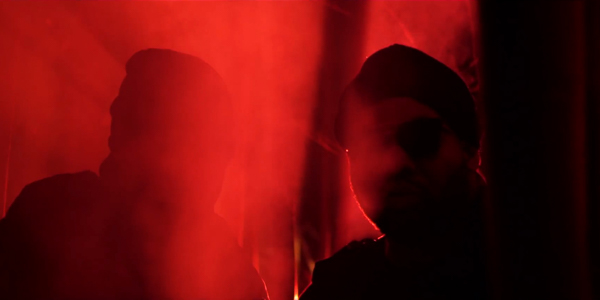 raekwon and p.u.r.e. surrounded by fog bathed in red light