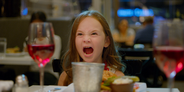 young girl screaming in a dinner